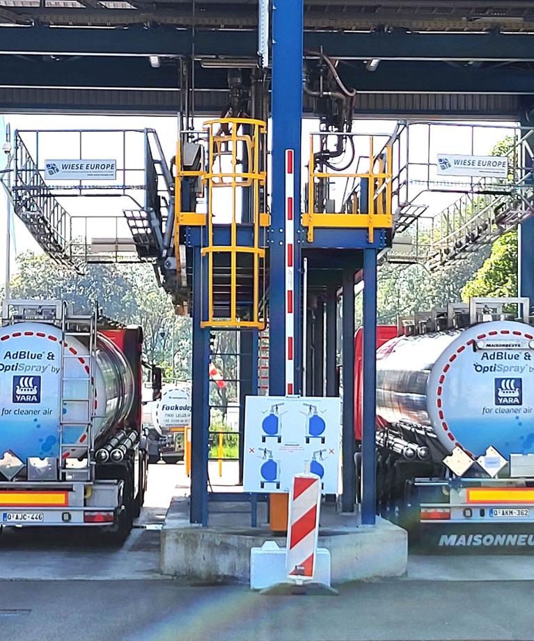 Two Yara trucks with the Adblue and Optispray branding at the back